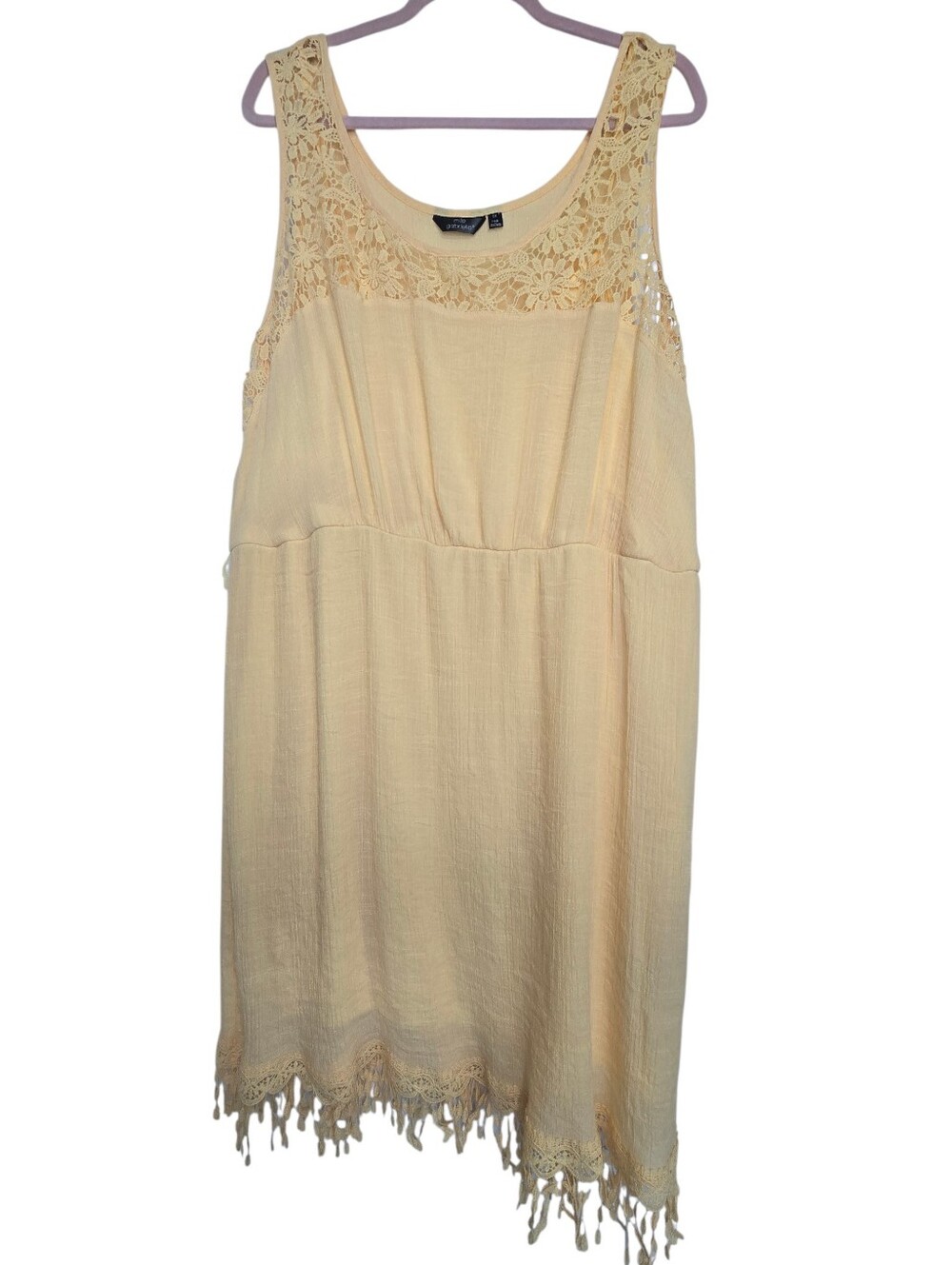 Sleeveless yellow babydoll dress featuring an elegant lace overlay neckline